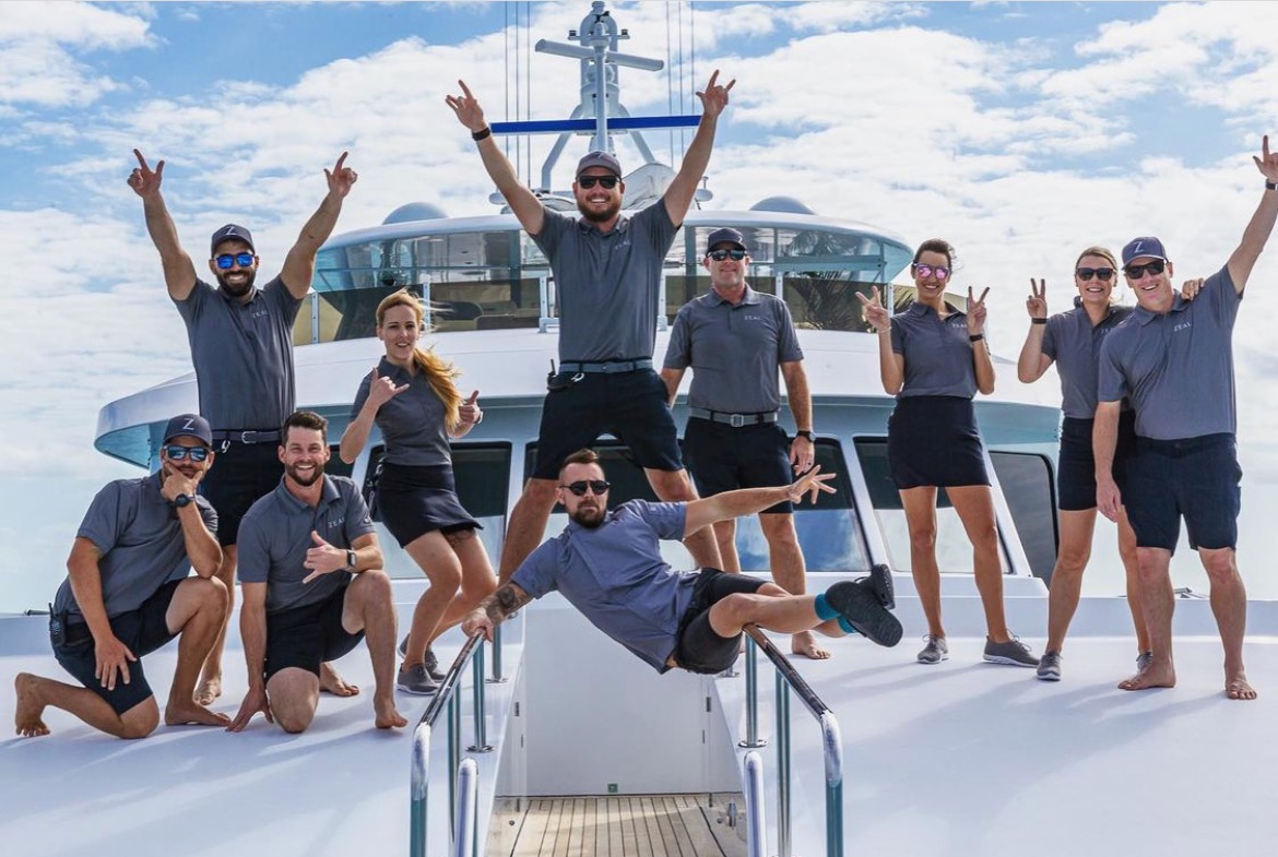 Excited yacht crew on board